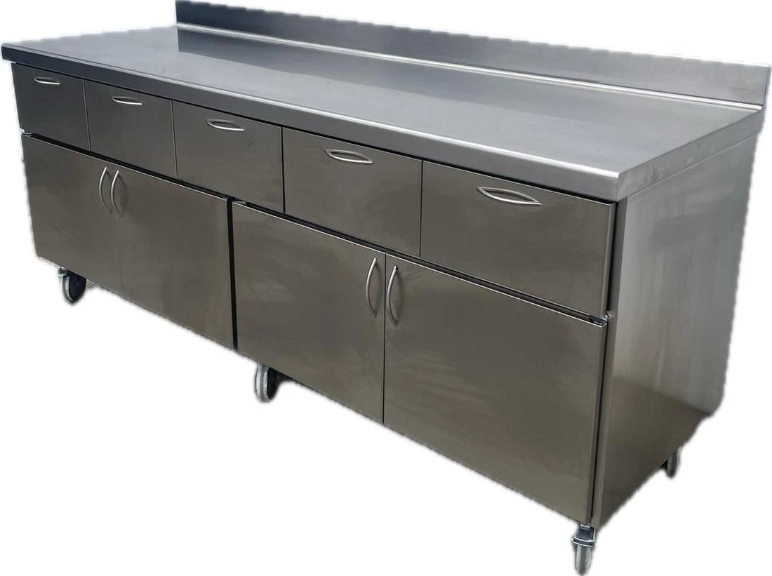 Mueble bajo con cajones sobre ruedas en acero inoxidable